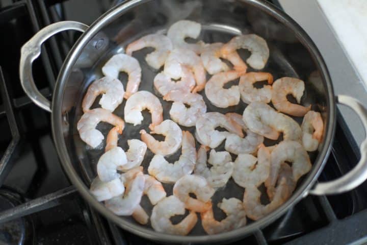 shrimp in a pan with hot oil.