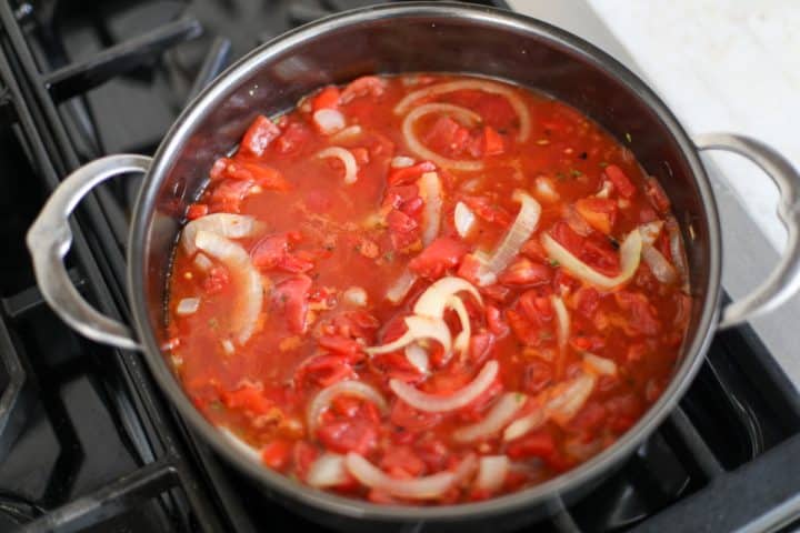simmering sauce in a pan.
