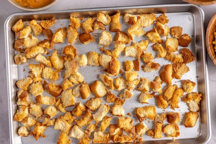 toasted bread cubes on a tray. 