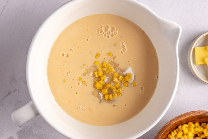 corn, milk, egg and sugar in a bowl. 