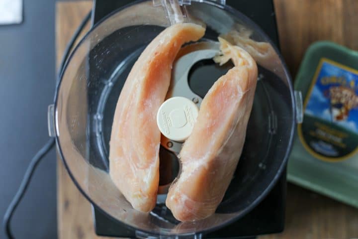 add chicken to a food processor. 