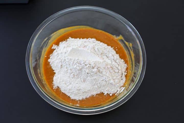 The wet and dry ingredients in a bowl. 