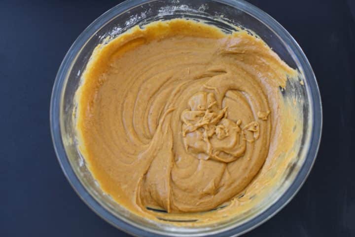 pumpkin cake batter in a bowl. 