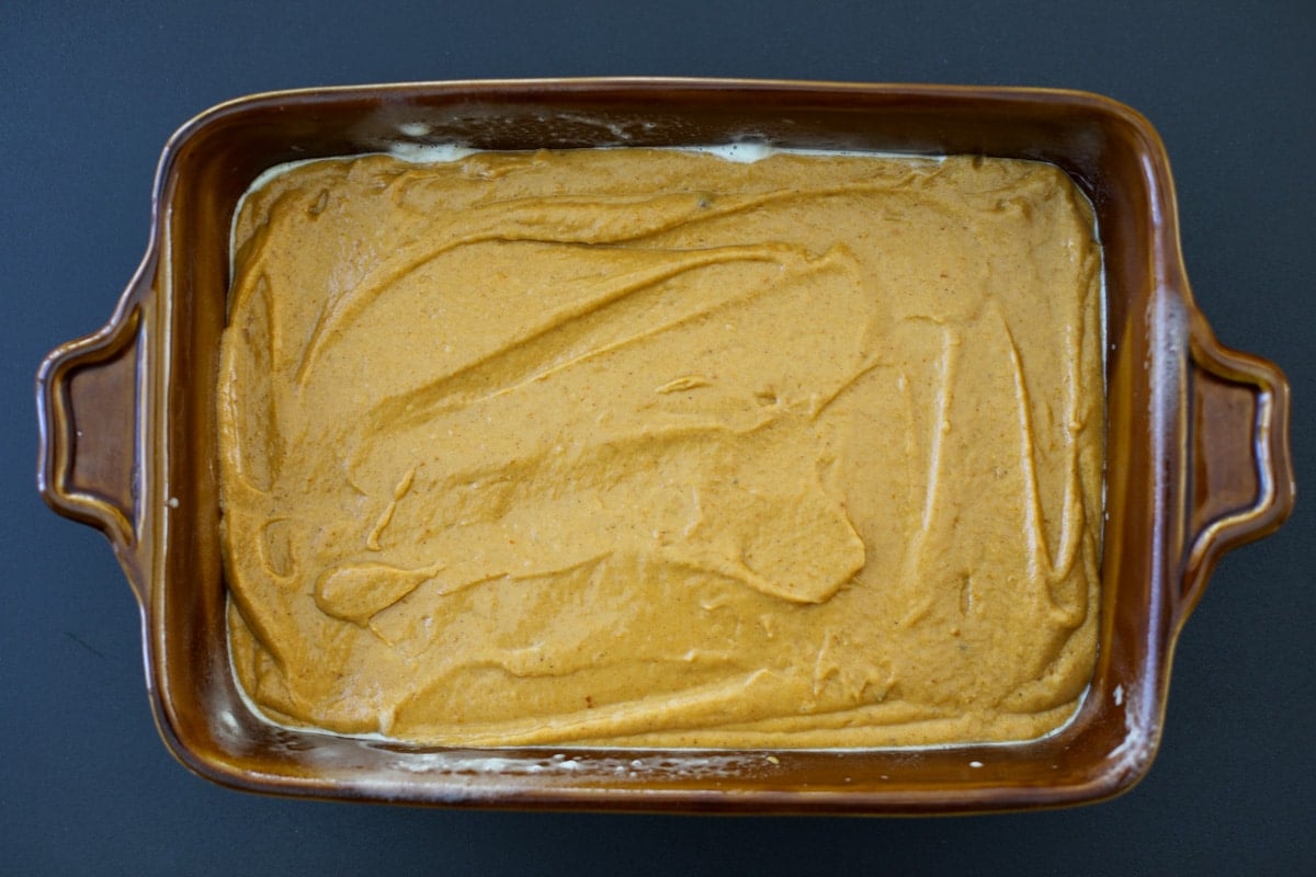 cake batter in the prepared baking dish. 