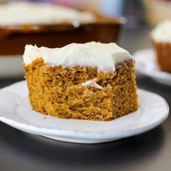 Slice of pumpkin cake on a plate.