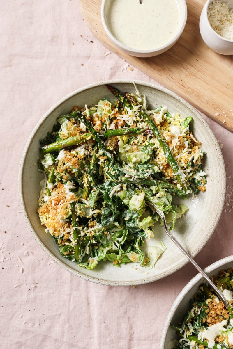 caesar salad with asparagus, grated egg and panko. 