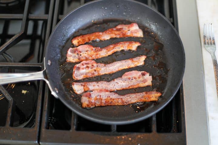 fried bacon in a pan.