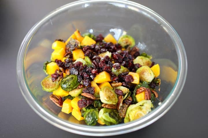 Roasted Brussels, Butternut Squash, Pecans, Bacon and Cranberries in a bowl.