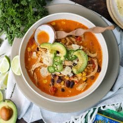 Chicken Tortilla Soup in a bowl with garnishes.