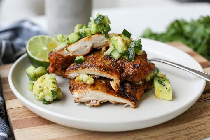 plated image - Blackened Grilled Chicken Thighs with Avocado Cucumber Salad – Healthyish Foods