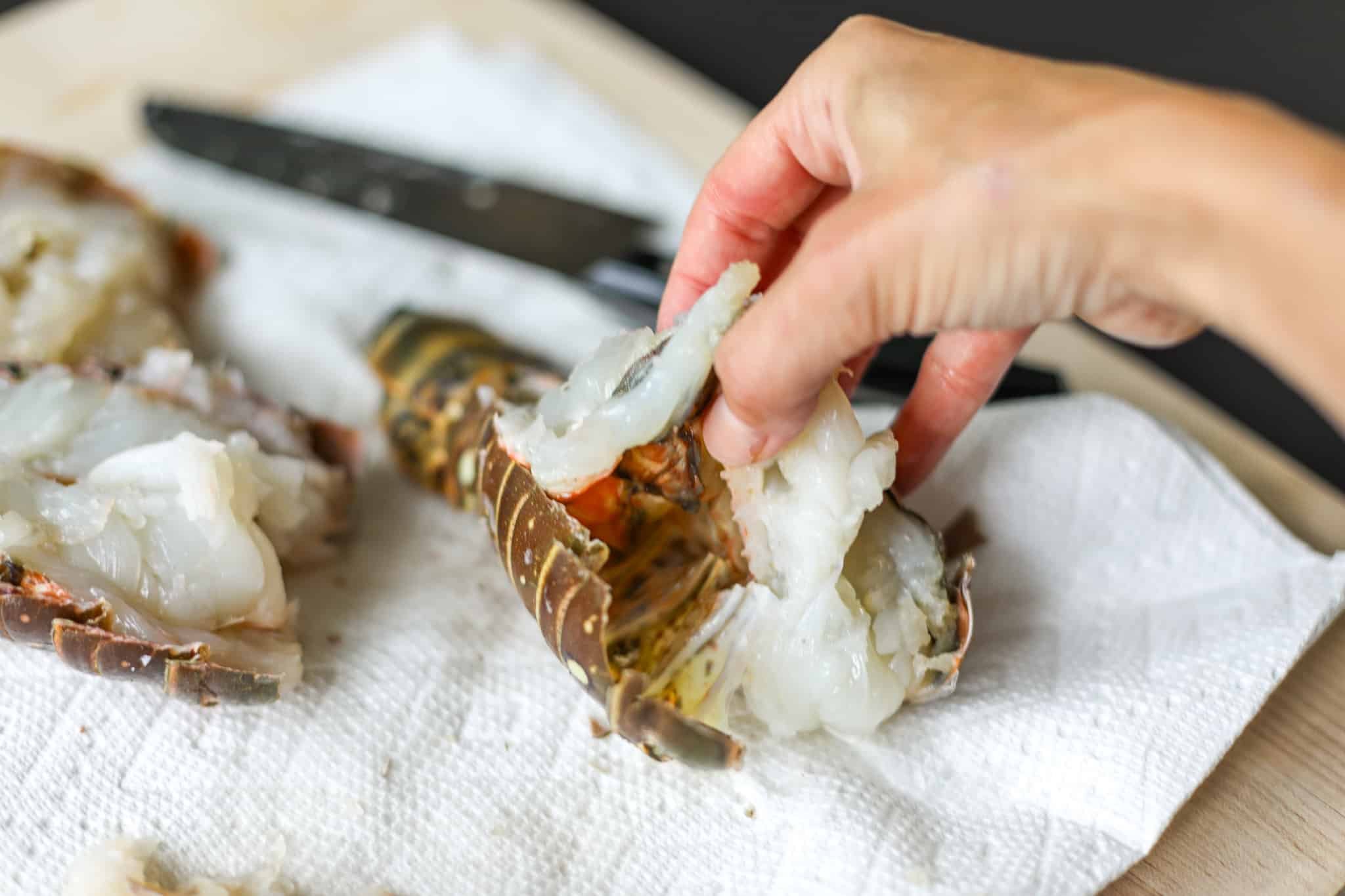 Releasing the lobster meat so it doesn't stick to the shell.