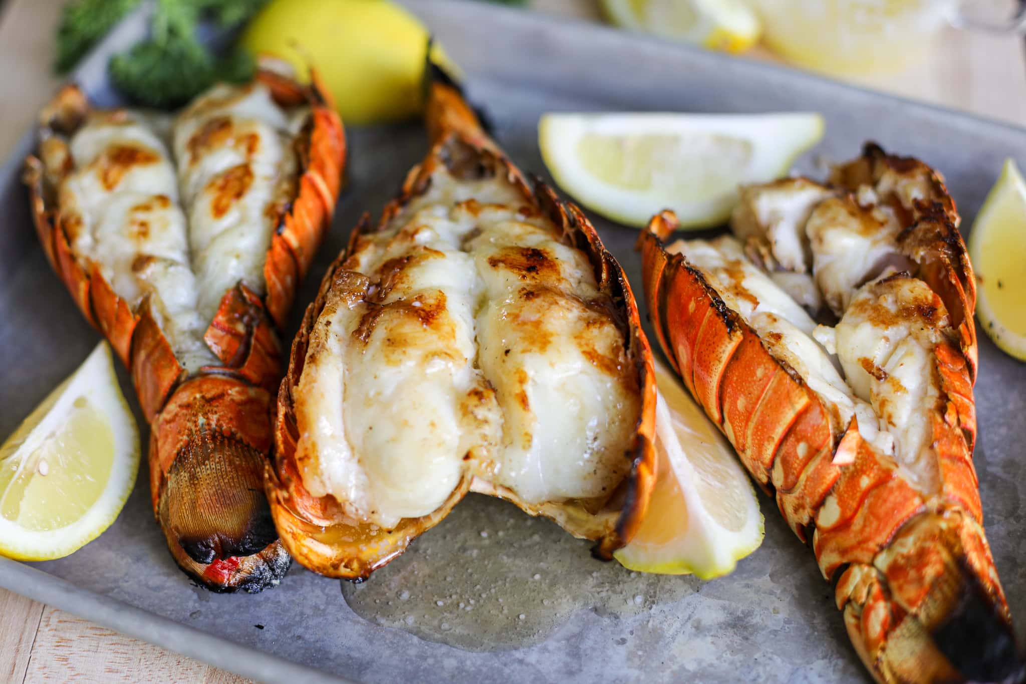 up close shot of grilled lobster tail recipe - Grilled Lobster Tails Recipe - Healthyish Foods