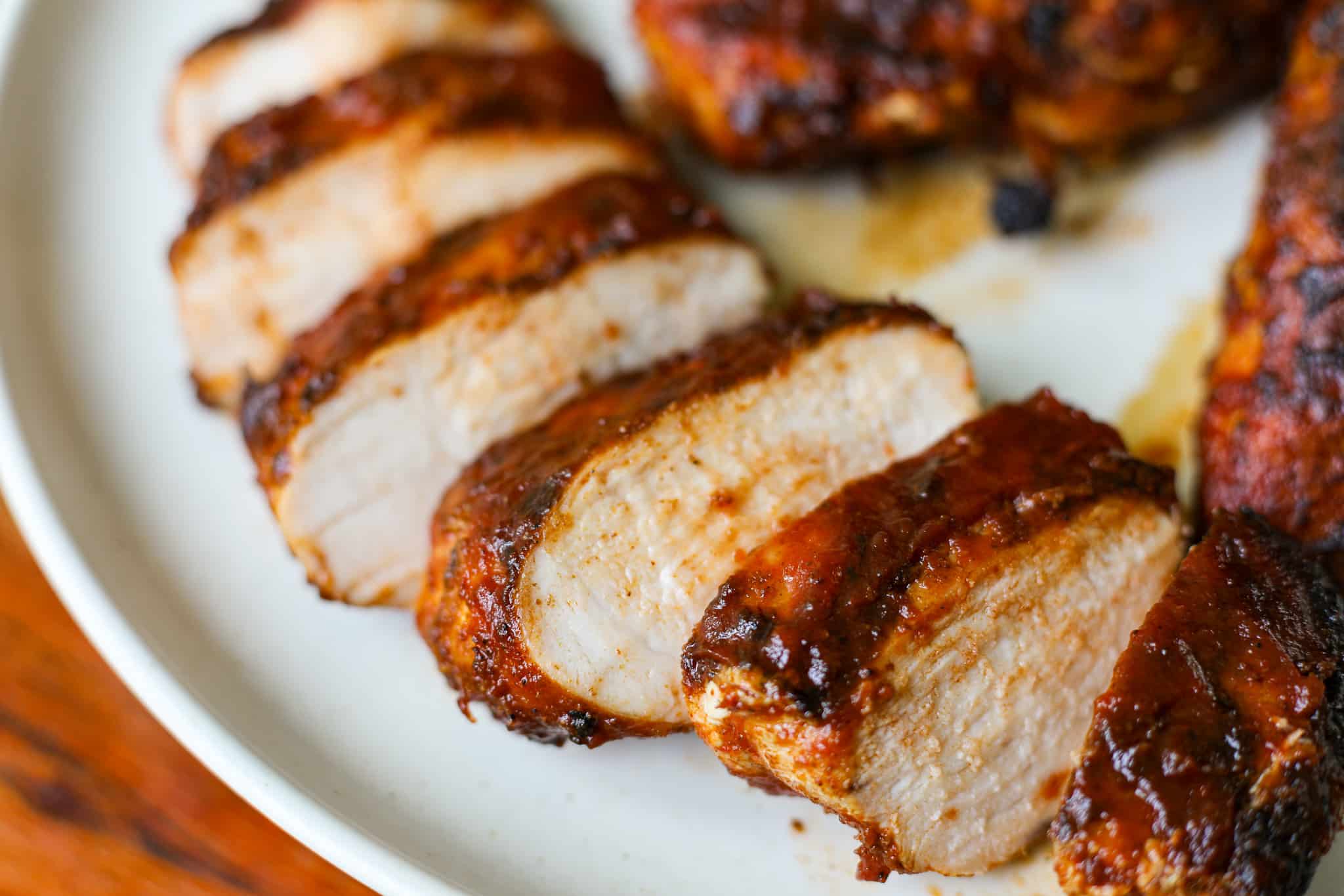sliced grilled BBQ chicken on a plate