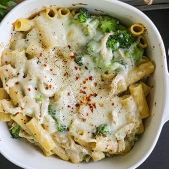 Chicken Broccoli Pasta in a bowl. Baked with cheese on top.