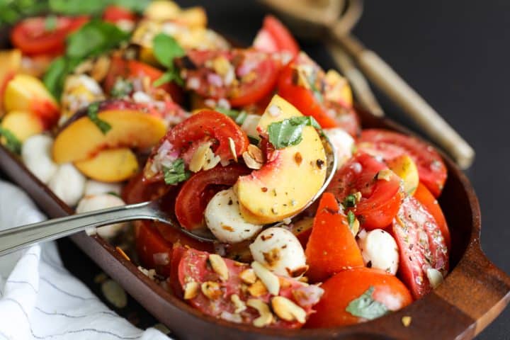 scoop of salad image - Peach and Tomato Salad Recipe – Healthyish Foods