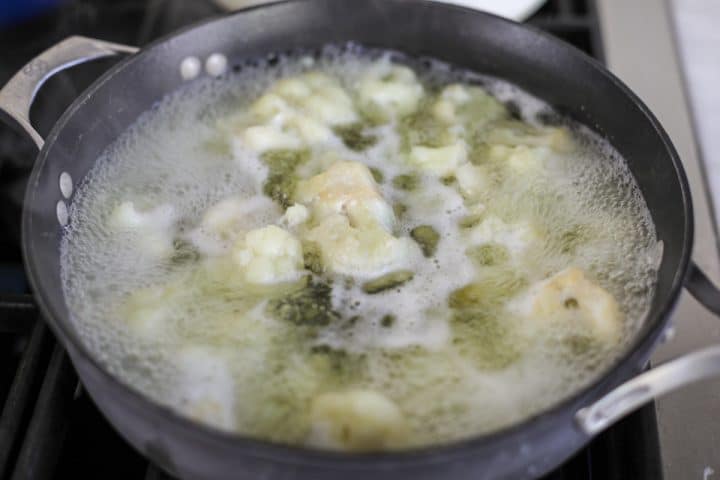 cauliflower florets in a pot.