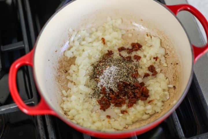 sautéed onions and spices in a pot.