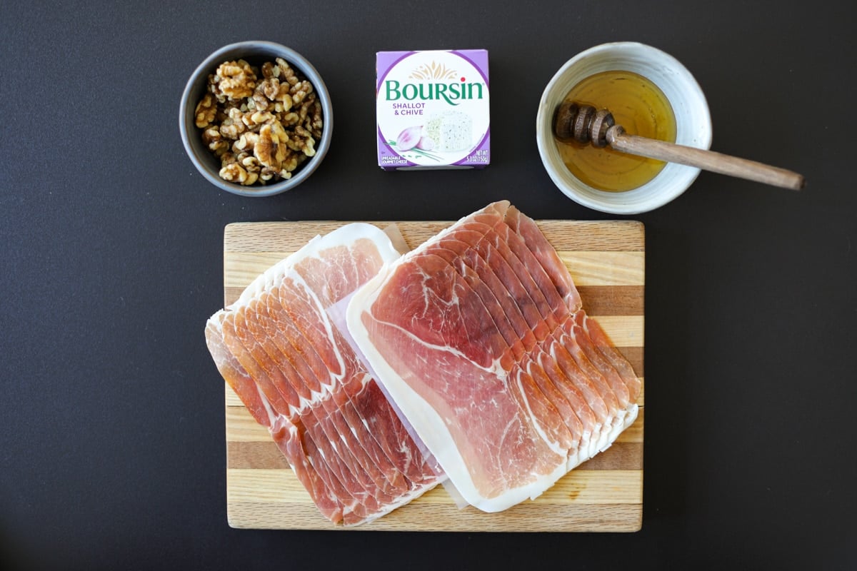 ingredients needed for crispy prosciutto wrapped Boursin Cheese with honey and chopped nuts.