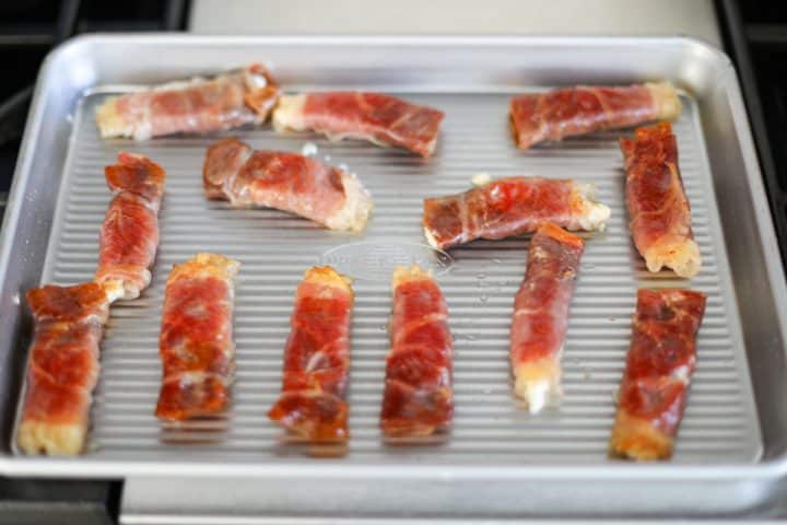 crispy prosciutto wraps on a tray.