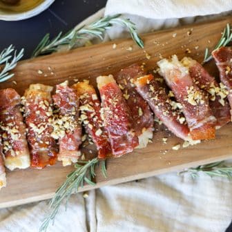 Crispy Prosciutto Wrapped Boursin Cheese with Honey and Chopped Nuts