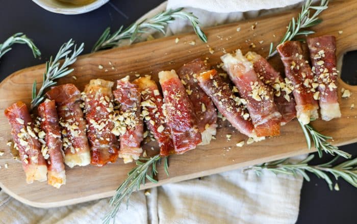 Crispy Prosciutto Wrapped Boursin Cheese with Honey and Chopped Nuts