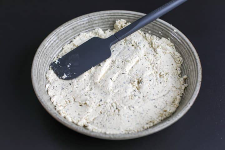 Boursin cheese spread out in a bowl.