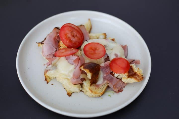 sliced tomatoes added to the torn sandwich salad.