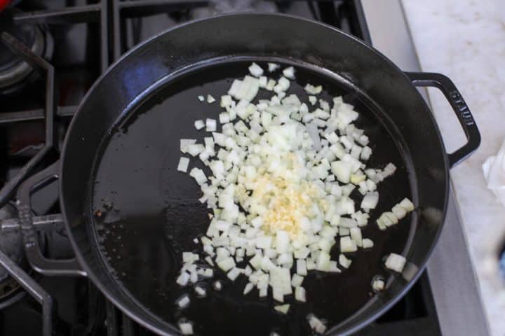 sautéed onions and garlic in a pan.