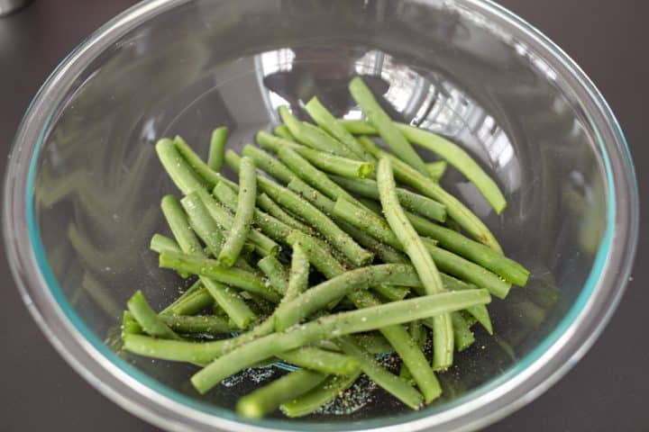 beans in a bowl with avocado oil, salt and pepper.