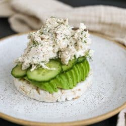 creamy tzatziki chicken salad piled high on a rice cake.