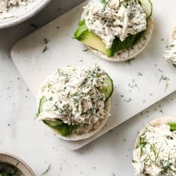 chicken salad over a rice cake with avocado.
