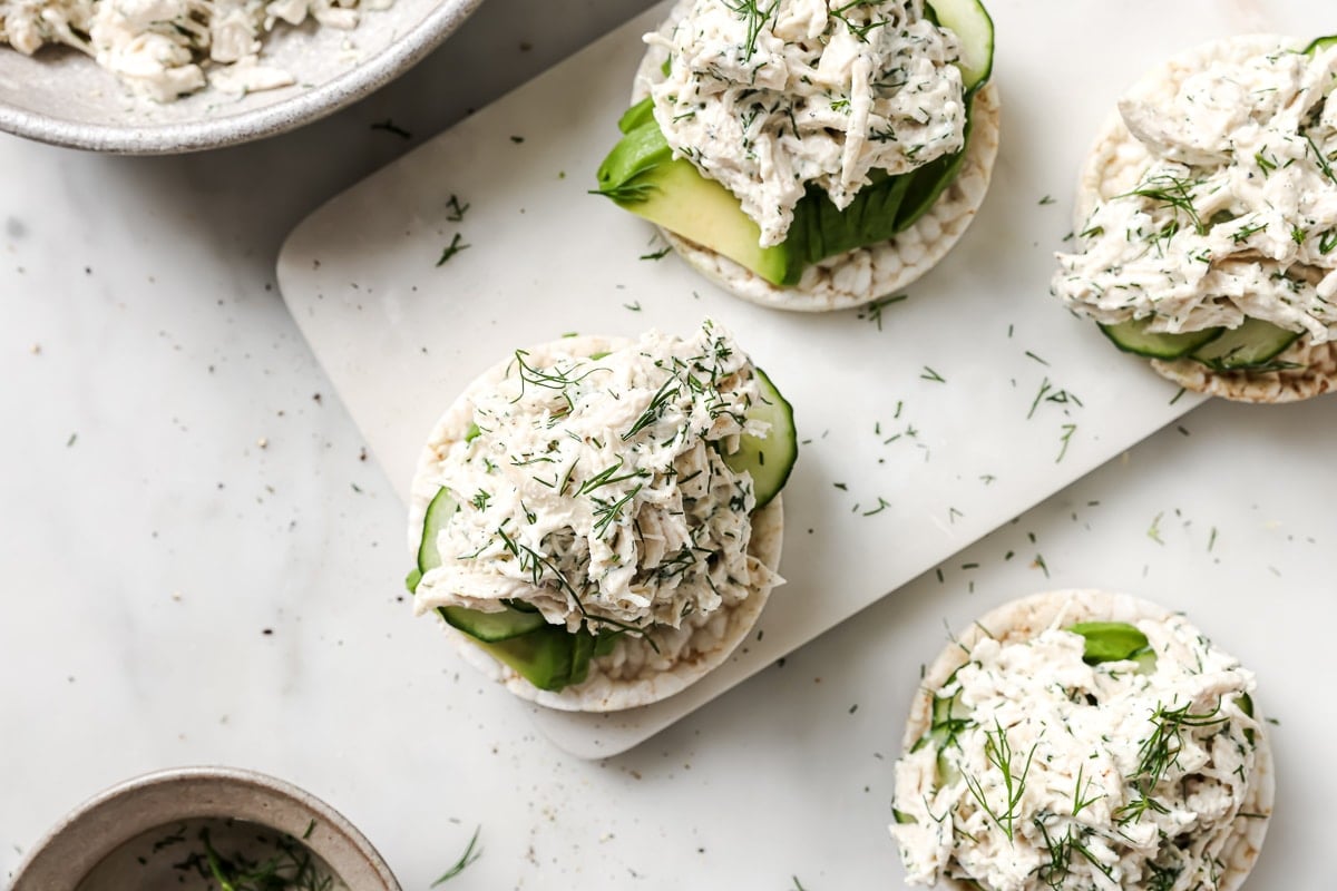 chicken salad over a rice cake with avocado. 