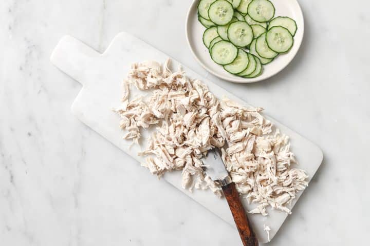 chicken chopped on a board.