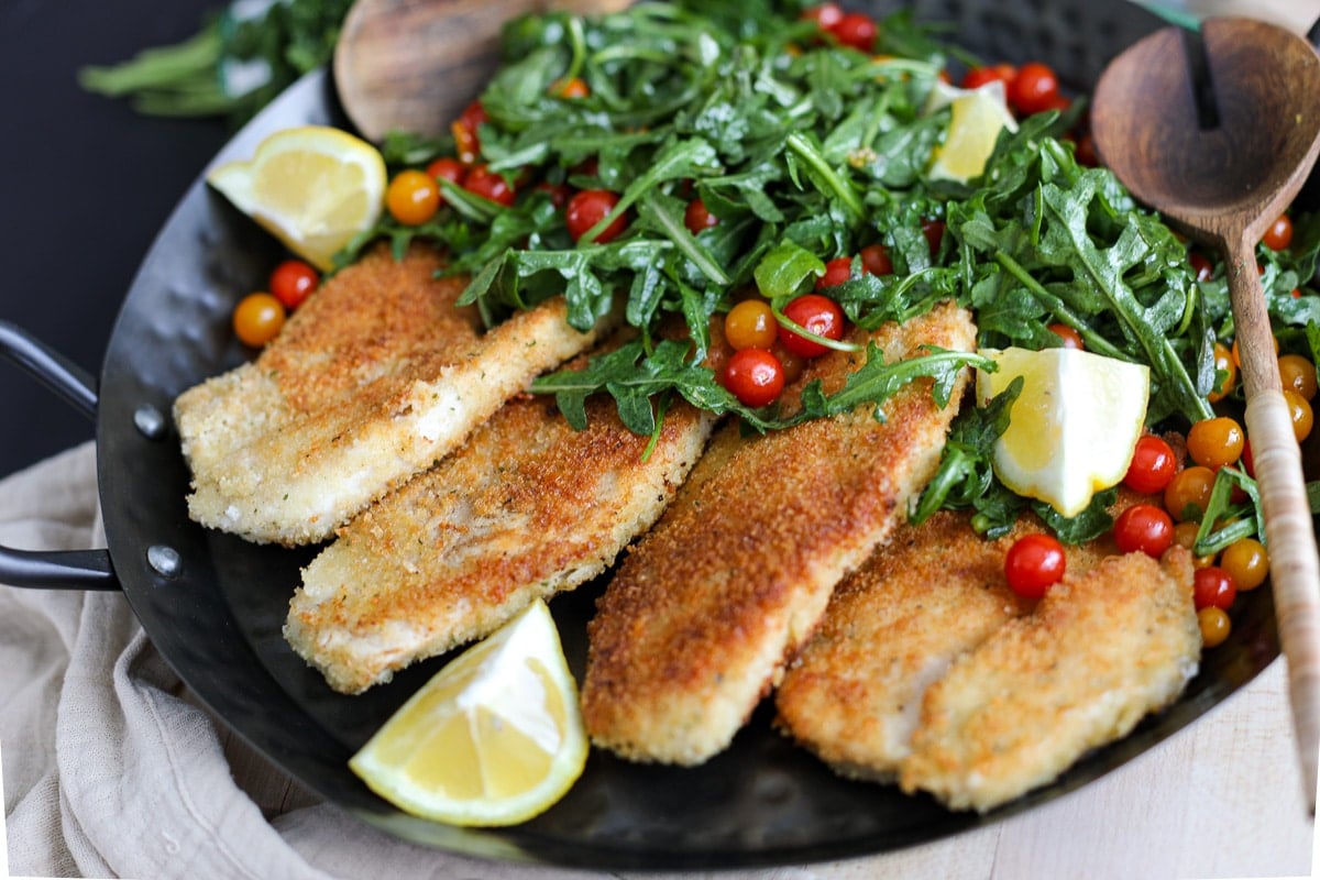 Crispy chicken on a tray with salad.