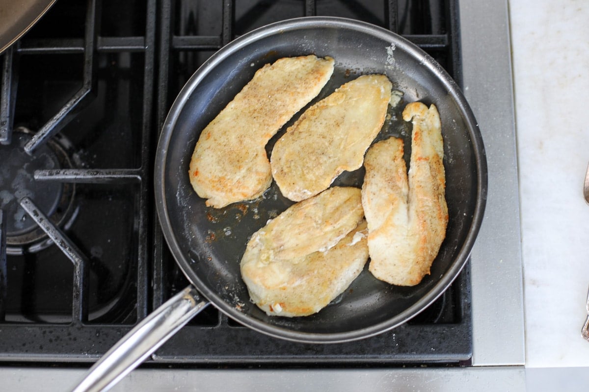 sautéed chicken in a pan.