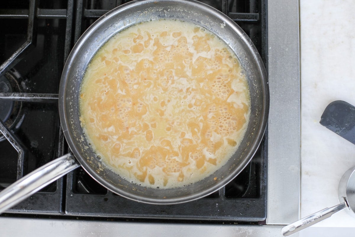 piccata sauce in a pan.