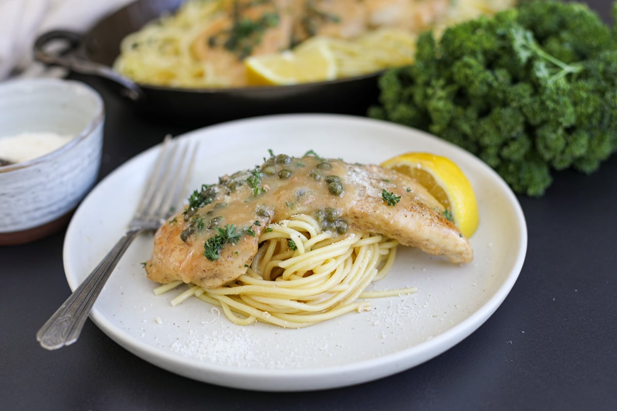 chicken piccata on a plate.