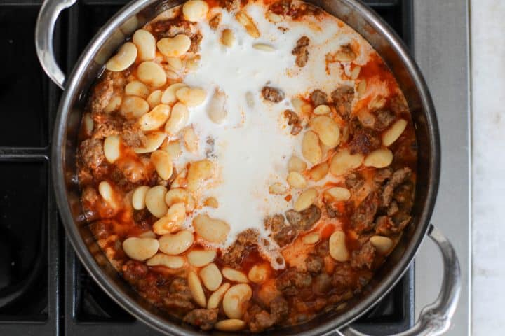 heavy cream added to the sausage and bean mixture.