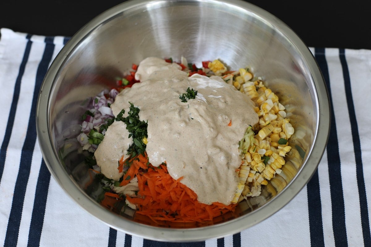 chicken and vegetables topped with parsley and dressing.