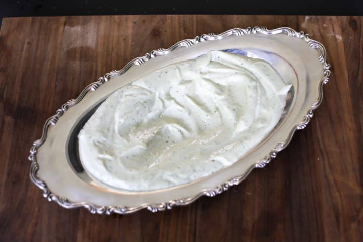 whipped pesto ricotta in a serving dish.