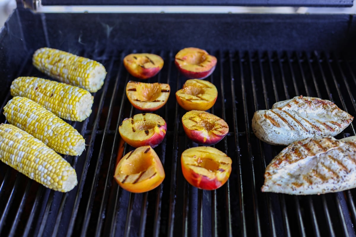 grilled corn, peaches and chicken.