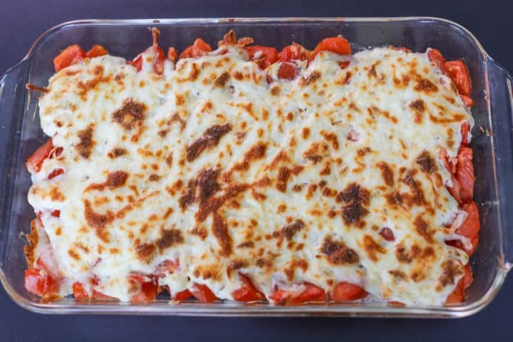 Tomato pie dip fresh from the oven with a crispy top.