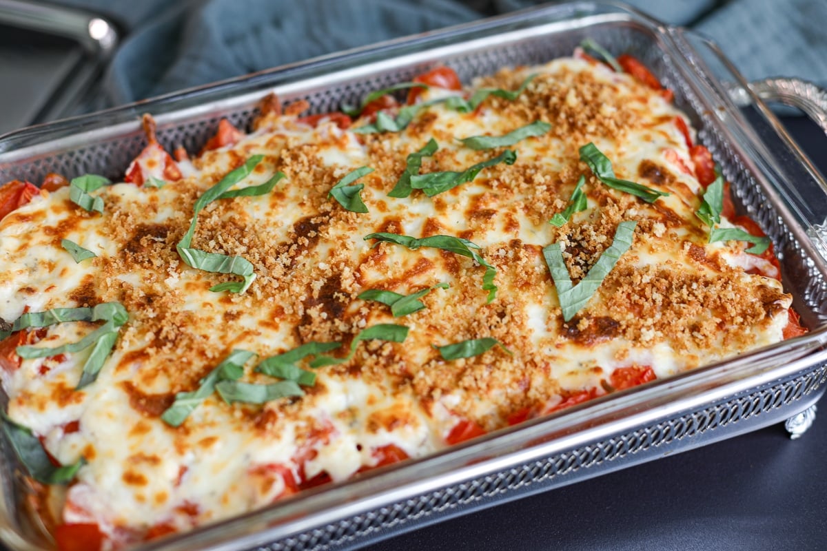tomato pie dip appetizer fully dressed with panko and basil.