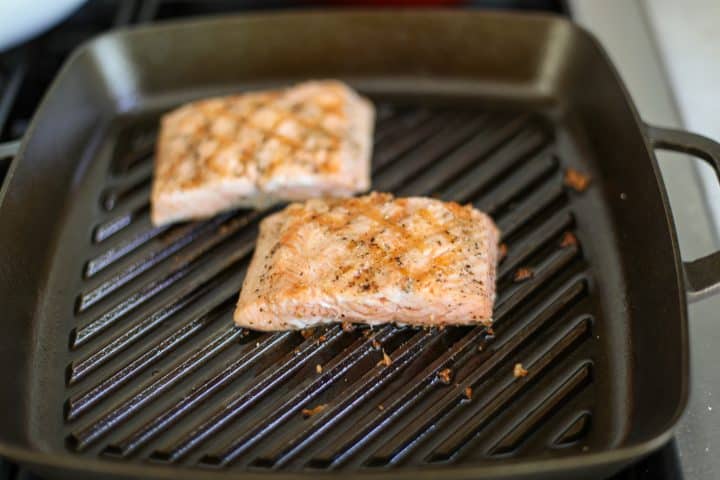 grilled salmon filets in a grill pan. 