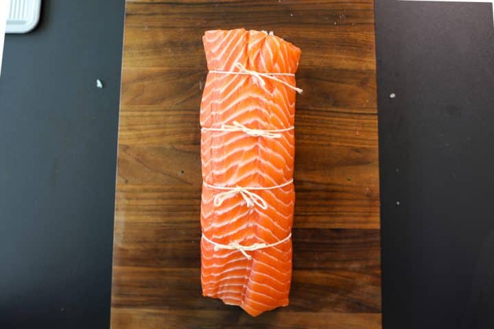 salmon rolled and tied closed.