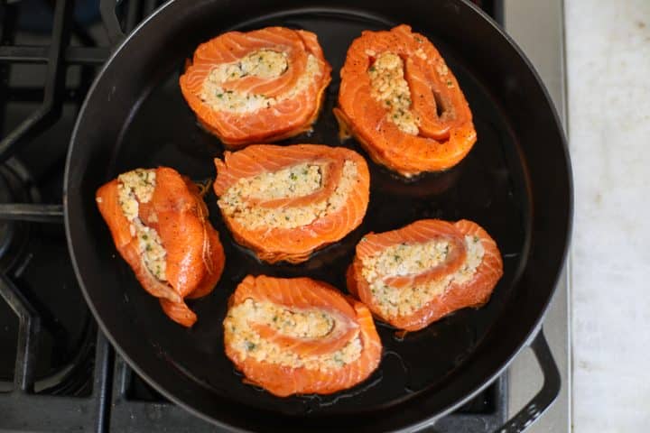 seared salmon in a pan.