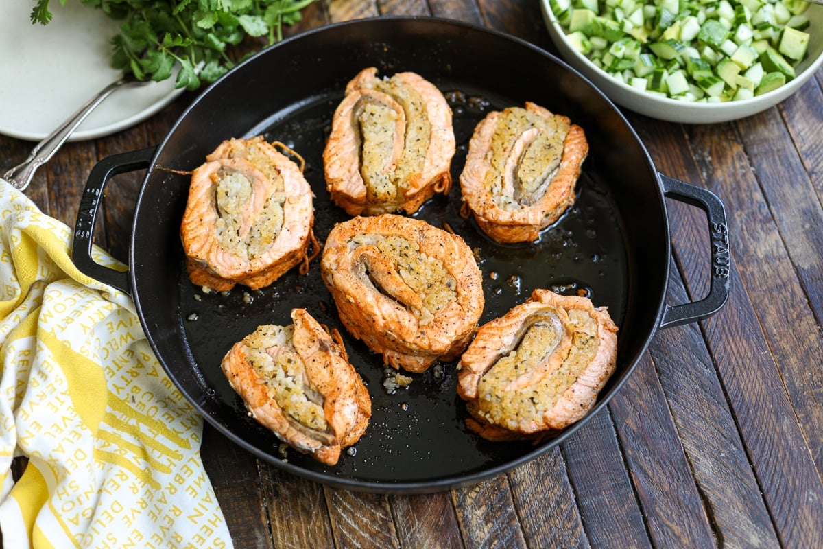 seared salmon in a pan.