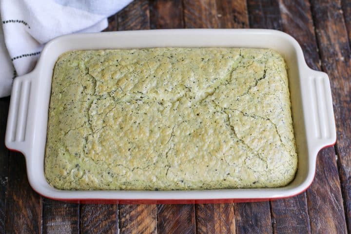 baked pesto eggs in a baking dish.