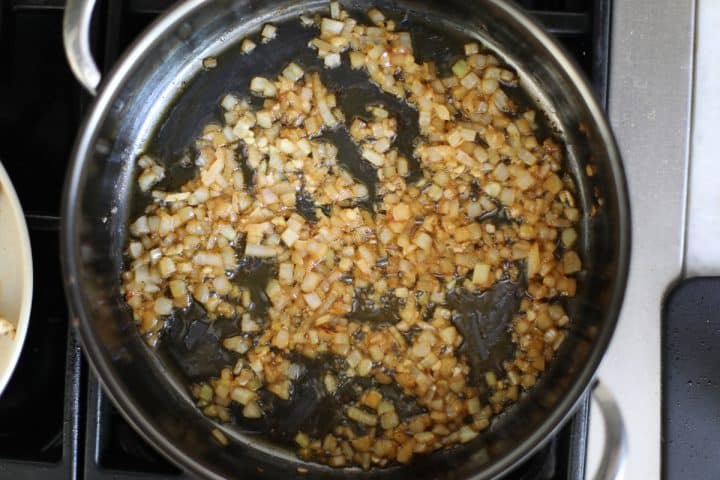 sauteed onions and garlic in a pan.