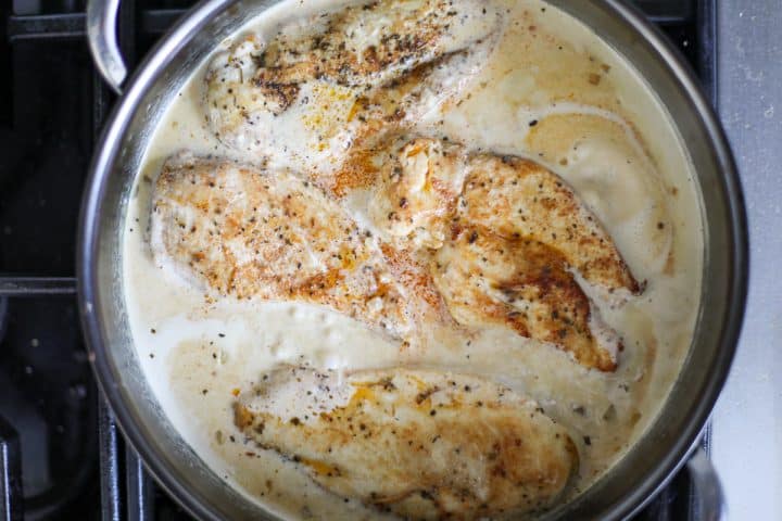 chicken and cream sauce in a pan. 